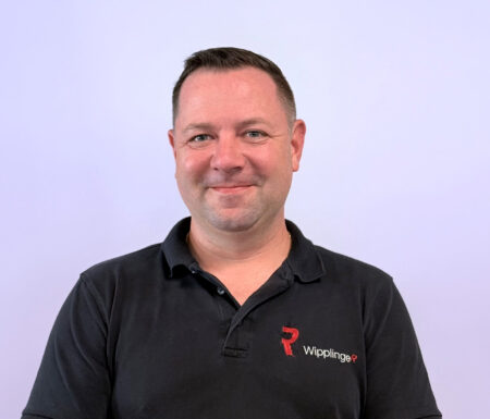 Portraitfoto eines Mannes mit schwarzem Wipplinger Polo