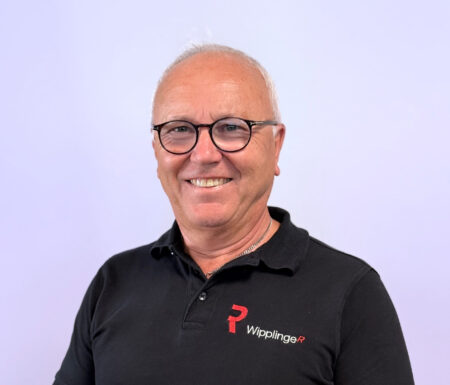 Portraitfoto eines Mannes mit schwarzem Wipplinger Polo